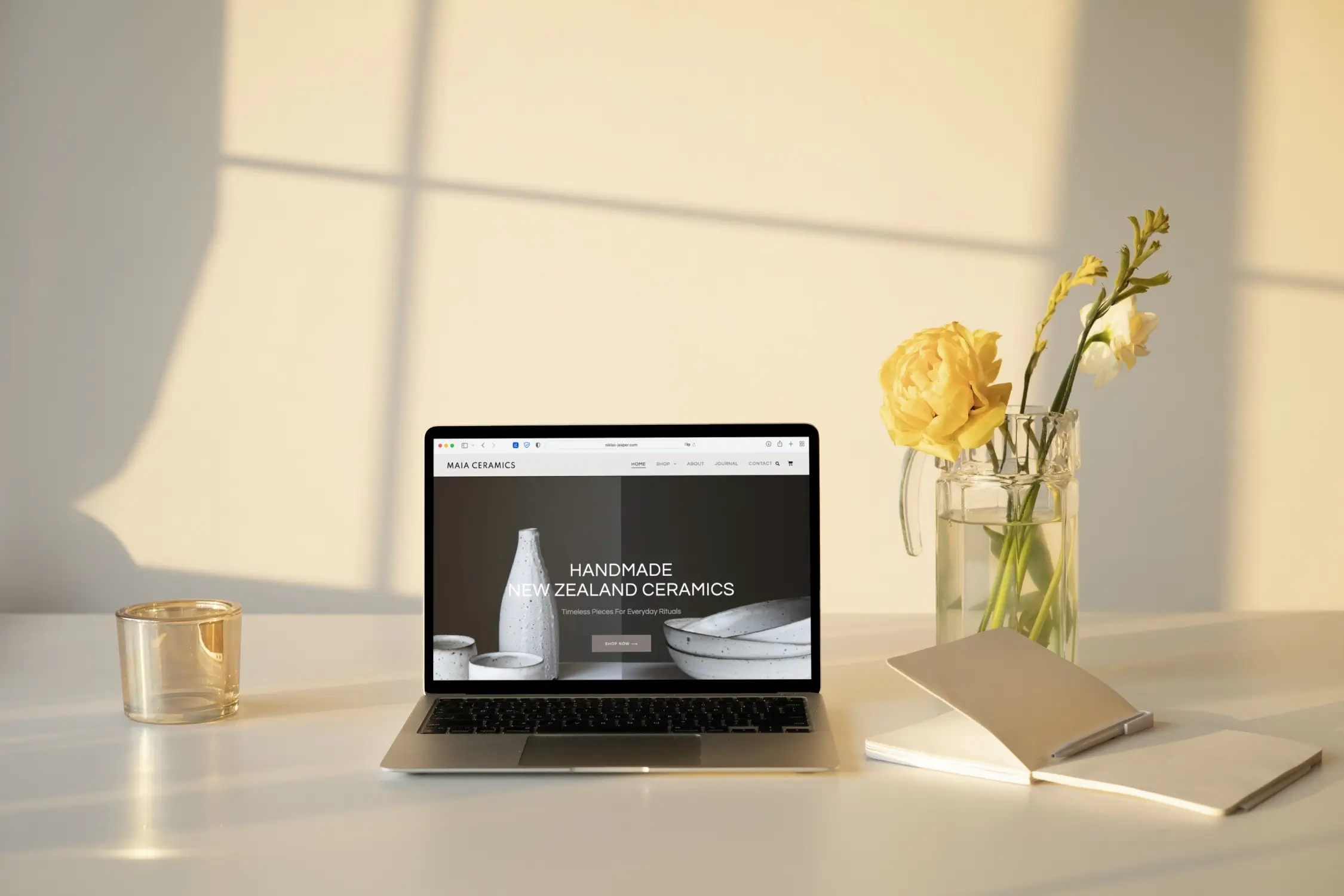 MacBook Air on the white Ceramic Store Website